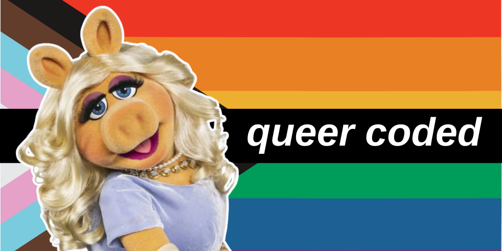 Miss Piggy wears a blue dress with a diamond necklace and white arm-length gloves.