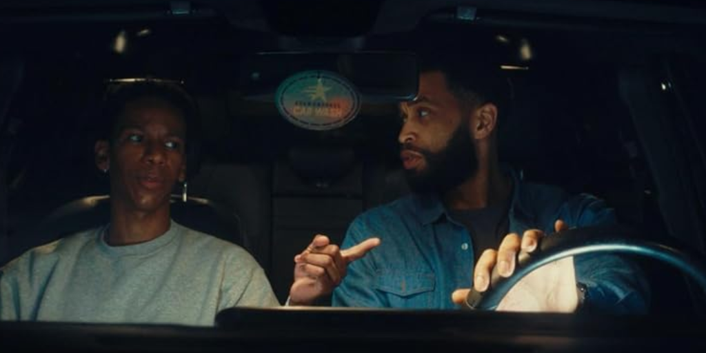 Duane Ervin and Stephen Cofield Jr talk in a car.