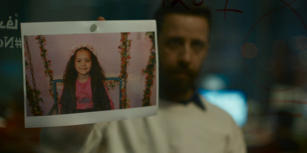 A man holds a picture of Palestinian girl Hind Rajab.