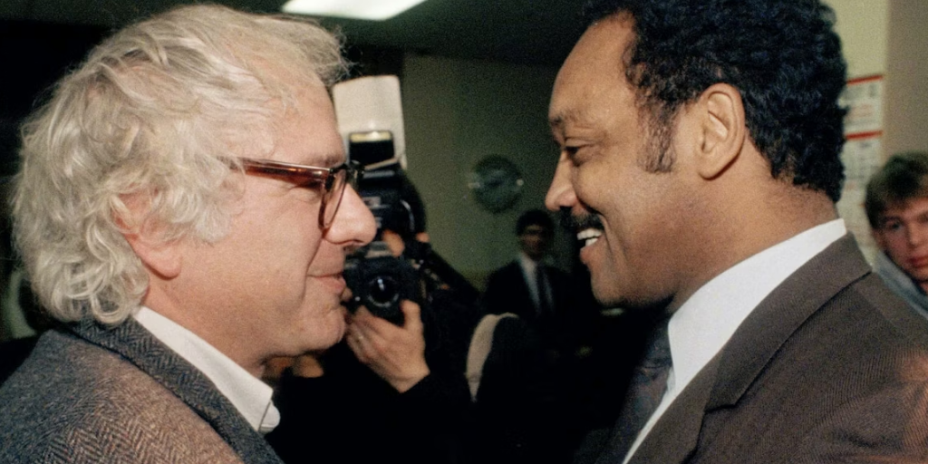 Bernie Sanders, then the mayor of Burlington, greets Jesse Jackson backstage at a 1988 Vermont rally where he endorsed Jackson’s presidential bid. AP Photo/Toby Talbot