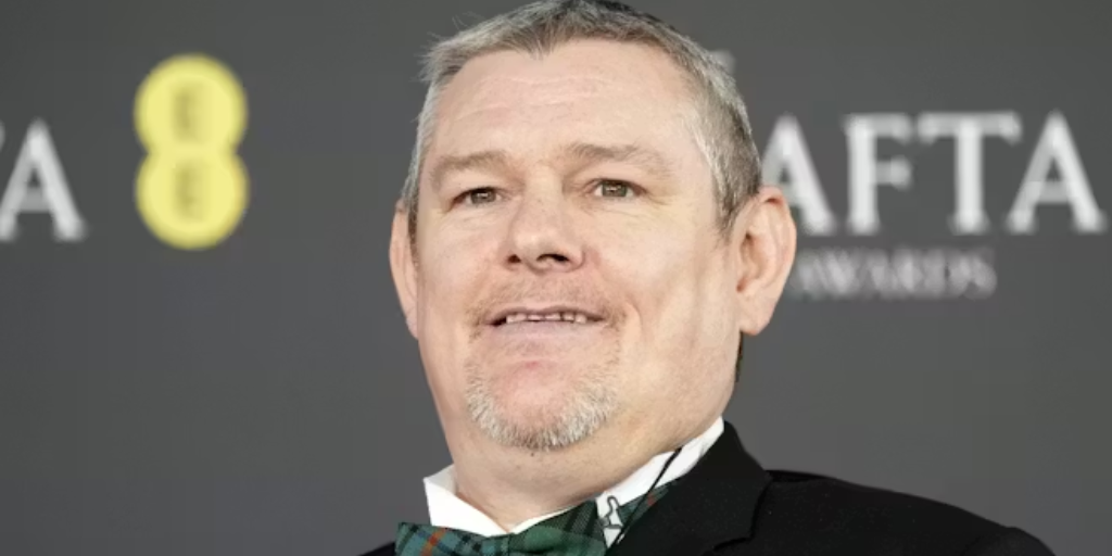 John Davidson pictured on the BAFTAs red carpet. Dominic Lipinski/Stringer via Getty Images