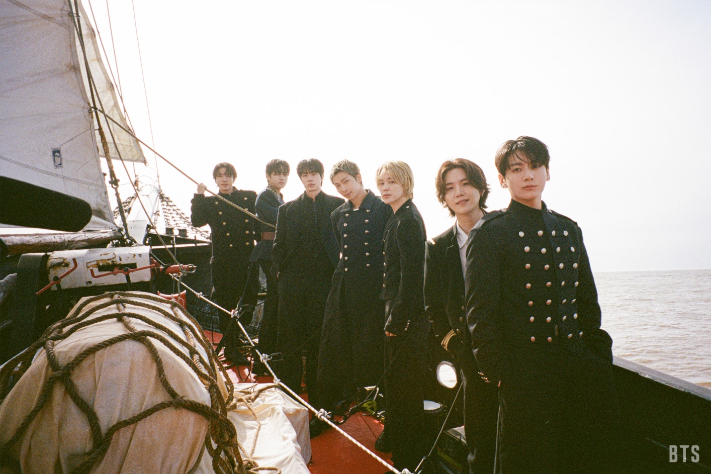 BTS in "Swim" music video, wearing nautical gear.