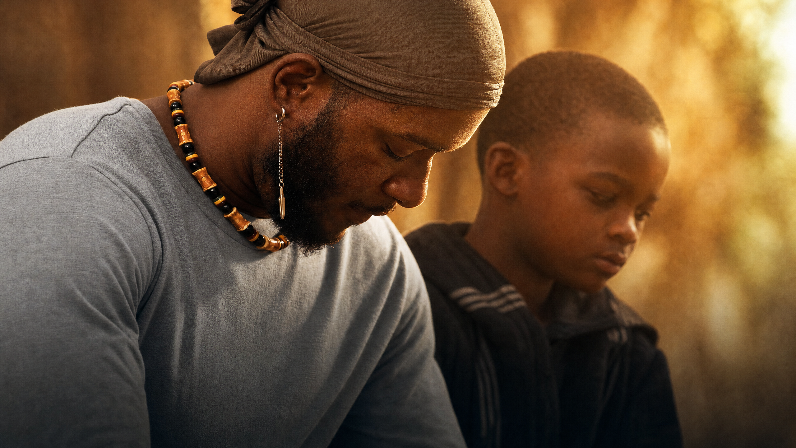 Reginald Haskins Jr. with one of the young stars of Measure of a Man. (Credit: Demetrius Jones)